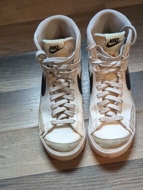 Nike Women's High-Top Sneakers in Off-White with Black Swoosh